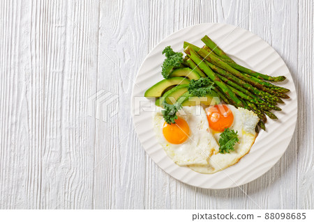 roast asparagus, ripe avocado and fried eggs roast asparagus, ripe avocado and fried eggs 88098685