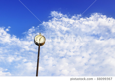 Sunny blue sky, clouds and clock 88099367