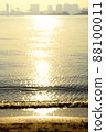 I stare blankly at the ocean illuminated by the setting sun 88100011