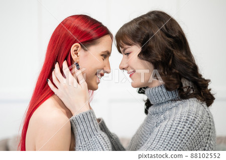 Young Caucasian women hugging tenderly. Same-sex relationships. 88102552