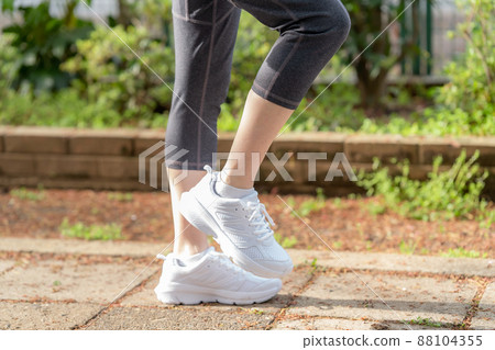 Woman suffering from knee pain, knee joint 88104355