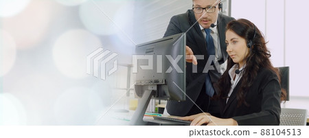 Business people wearing headset working in office broaden view Business people wearing headset working in office broaden view 88104513