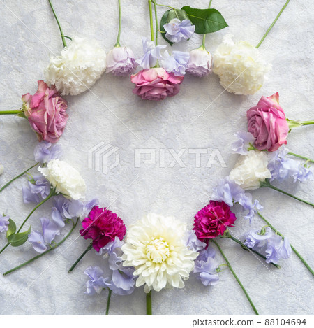 Heart frame made of flowers Heart frame made of flowers 88104694