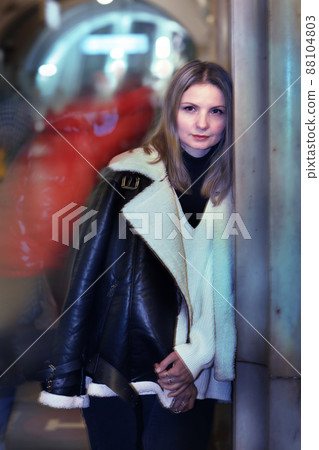 young blond slavic woman with long hair in black leather jacket closeup photo on city undeground station background young blond slavic woman with long hair in black leather jacket closeup photo on city undeground station background 88104803