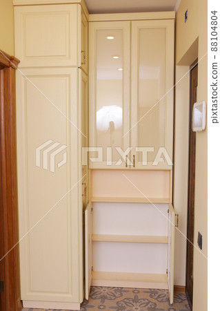 white brand new furniture - wardrobe with closeup photo 88104804