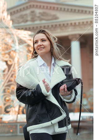 blond girl with long hair in black leather jacket closeup street portrait blond girl with long hair in black leather jacket closeup street portrait 88104807