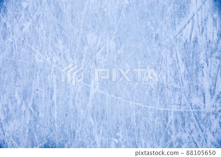 Ice background with marks from skating and hockey, blue texture of rink surface with many scratches Ice background with marks from skating and hockey, blue texture of rink surface with many scratches 88105650