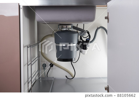 Garbage Disposal under the modern sink, waste chopper concept Garbage Disposal under the modern sink, waste chopper concept 88105662
