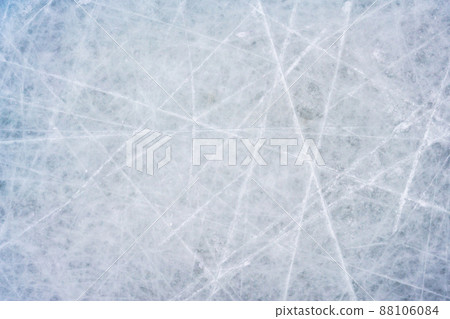 Ice background with marks from skating and hockey, blue texture of rink surface with scratches Ice background with marks from skating and hockey, blue texture of rink surface with scratches 88106084