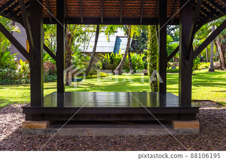 beautiful wooden gazebo and nice green lawn 88106195