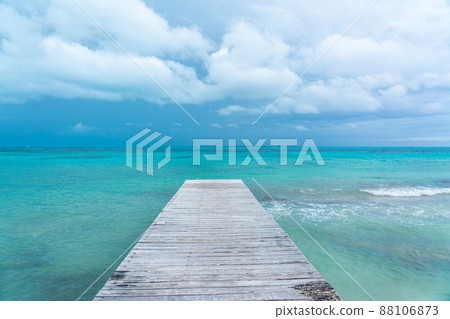 Caribbean wooden pier with turquoise aqua sea Caribbean wooden pier with turquoise aqua sea 88106873