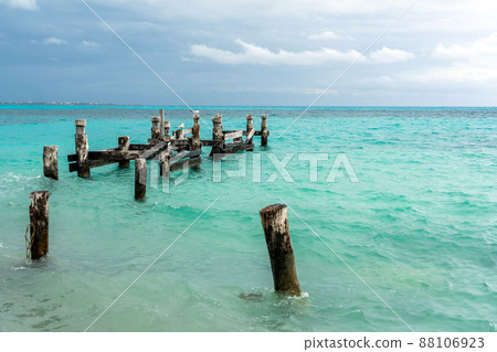 Remains of an old pier on Playa Caracol beach in Cancun, Mexico 88106923