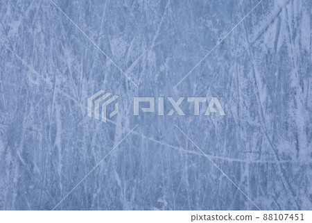 Ice background with marks from skating and hockey, blue texture of rink surface with many scratches Ice background with marks from skating and hockey, blue texture of rink surface with many scratches 88107451