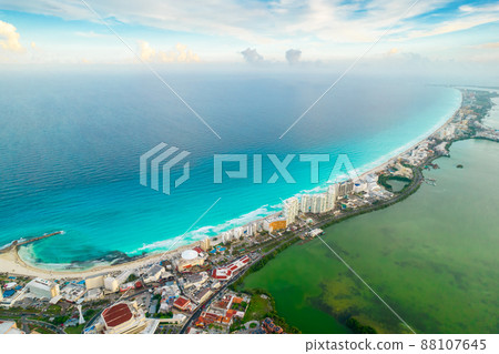 Aerial panoramic view of Cancun beach and city hotel zone in Mexico. Caribbean coast landscape of Mexican resort with beach Playa Caracol and Kukulcan road. Riviera Maya in Quintana roo region on 88107645
