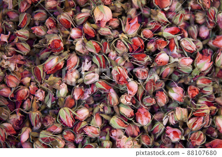 Dried rosebuds background texture closeup. 88107680