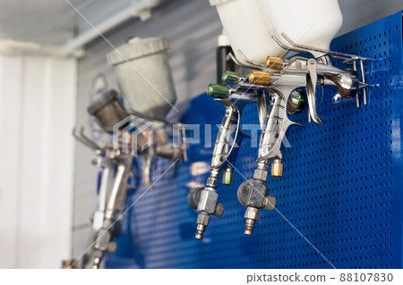 airbrush for car painting, spray gun in auto repair shop airbrush for car painting, spray gun in auto repair shop 88107830