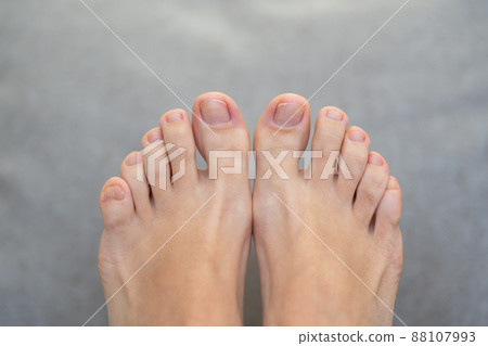 Closeup of female feet and toes on white background. Healthy feet concept 88107993
