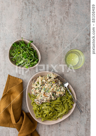 Pasta with champignons fried in sour cream 88108489