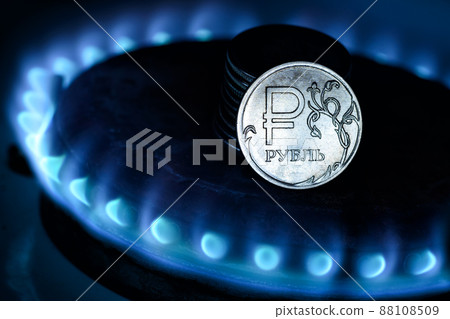 Gas burner and ruble coin, Russian money on home gas stove Gas burner and ruble coin, Russian money on home gas stove 88108509