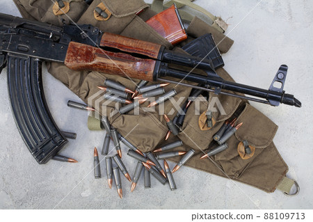 Kalashnikov ak gun and Chicom Chest Rig with 7,62 mm cartridges Kalashnikov ak gun and Chicom Chest Rig with 7,62 mm cartridges 88109713