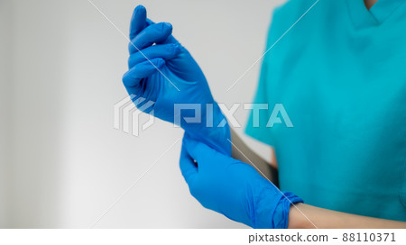 Surgeon preparing for surgery 88110371