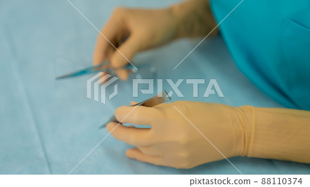 Surgeon preparing for surgery 88110374