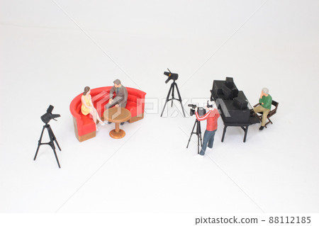 the Presenters and video camera operator working in studio. News broadcasting the Presenters and video camera operator working in studio. News broadcasting 88112185