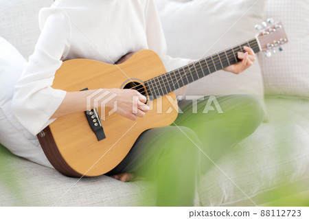 Female parts cut playing the guitar Female parts cut playing the guitar 88112723