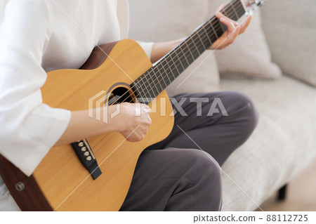 Female parts cut playing the guitar Female parts cut playing the guitar 88112725