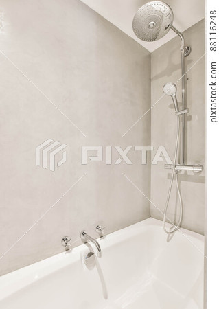 Interior of modern bathroom with bathtub and shower Interior of modern bathroom with bathtub and shower 88116248