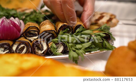 Georgian cuisine. Eggplant rolls. Eggplant rolls with walnut and garlic. Georgian cuisine. Eggplant rolls. Eggplant rolls with walnut and garlic. 88117653