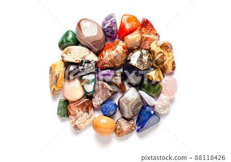 Mineral stones on a white background. The concept of using minerals and crystals in astrology and alternative or complementary medicine. Copy space. Mineral stones on a white background. The concept of using minerals and crystals in astrology and alternative or complementary medicine. Copy space. 88118426