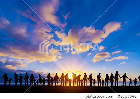 Silhouette of people holding hands with the Asahi 88119562
