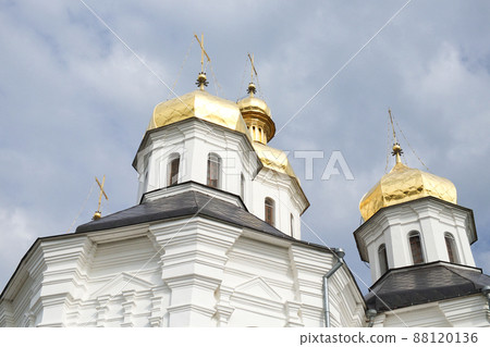 Gilded domes of an ancient Orthodox church against the sky. Catherine's Church is a functioning church in Chernihiv Gilded domes of an ancient Orthodox church against the sky. Catherine's Church is a functioning church in Chernihiv 88120136