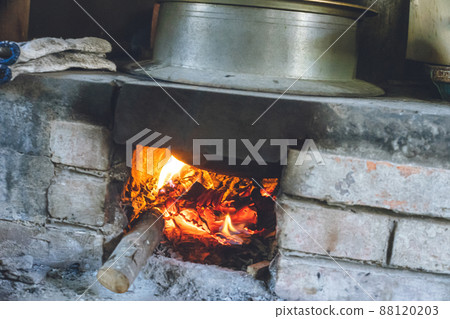 Delicious rice cooked in a stove in the earthen-floored kitchen of a traditional Japanese house Delicious rice cooked in a stove in the earthen-floored kitchen of a traditional Japanese house 88120203