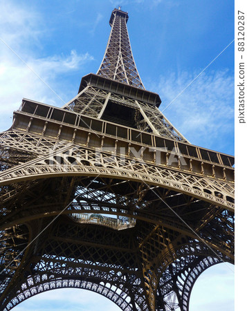 Landmark Eiffel Tower and blue sky low angle in Paris, France 88120287