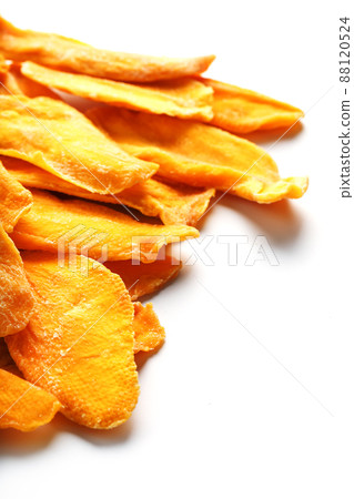 Dried mango sliced on a white background with free space 88120524