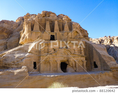 Obelisk tomb and clear blue sky at Petra archaeological site in Jordan Obelisk tomb and clear blue sky at Petra archaeological site in Jordan 88120642