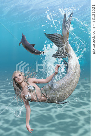 A cute smiling mermaid happily swimming in the ocean with dolphins 88121521