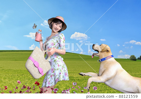 A smiling girl in a dress with a Labrador retriever and a straw hat takes a walk 88121559