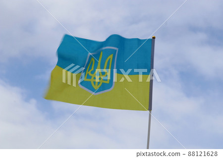 Blurred Ukrainian flag fluttering in strong wind. 88121628