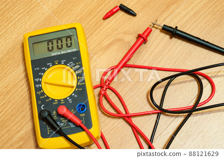 Modern digital multimeter on a floor. 88121629