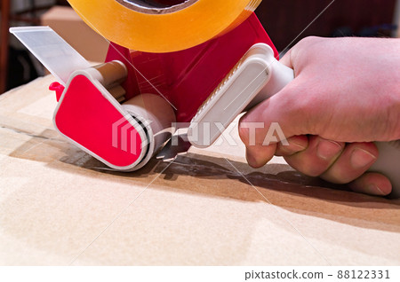 Packing the box with scotch tape dispenser Packing the box with scotch tape dispenser 88122331