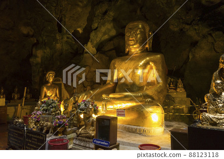 Phetchaburi, Thailand - November 11, 2018 : The golden Buddha inside Khao Luang Cave in Phetchaburi,Thailand on November 11, 2018. Phetchaburi, Thailand - November 11, 2018 : The golden Buddha inside Khao Luang Cave in Phetchaburi,Thailand on November 11, 2018. 88123118