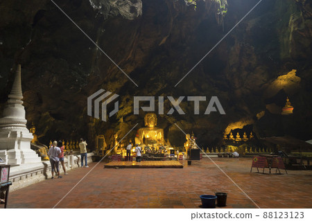 Phetchaburi, Thailand - November 11, 2018 : The golden Buddha inside Khao Luang Cave in Phetchaburi,Thailand on November 11, 2018. Phetchaburi, Thailand - November 11, 2018 : The golden Buddha inside Khao Luang Cave in Phetchaburi,Thailand on November 11, 2018. 88123123