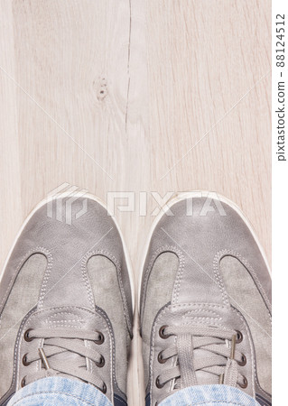 Comfortable gray leather shoes on board, male footwear, place for text Comfortable gray leather shoes on board, male footwear, place for text 88124512
