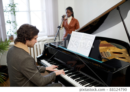 Pianist playing the piano in the classroom 88124790