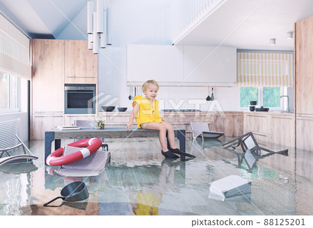 Boy playing On Table While Flooding in the kitchen. 88125201