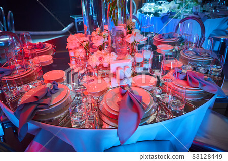 Table setup in red light. Ready to event. Shallow dof 88128449