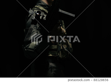 Soldier holding a gun 88128656